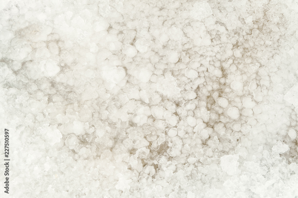 Natural background of bright thawed snow. Frozen snow texture. Natural background of bright thawed snow. Frozen snow texture.