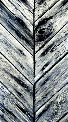 Gray old boards with knots and nails