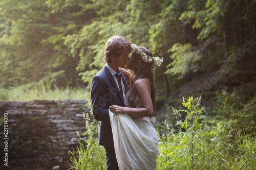 Affectionate couple kissing in forest