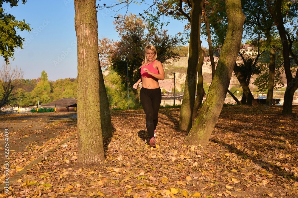 young woman train in autumn city park young woman train in autumn city park
