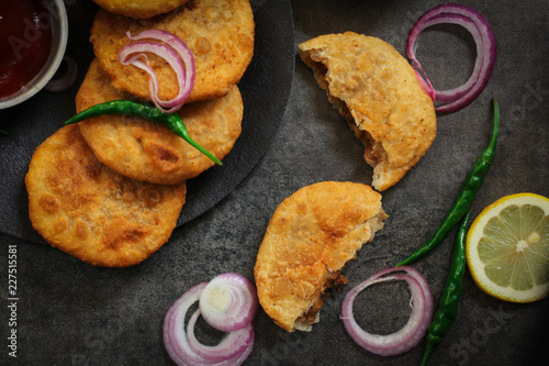 Rajasthani Kachori served with green chutney / Indian Diwali snacks photo