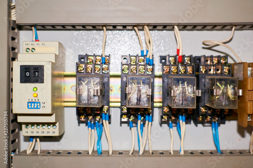 Several old relays with connected colored wires.