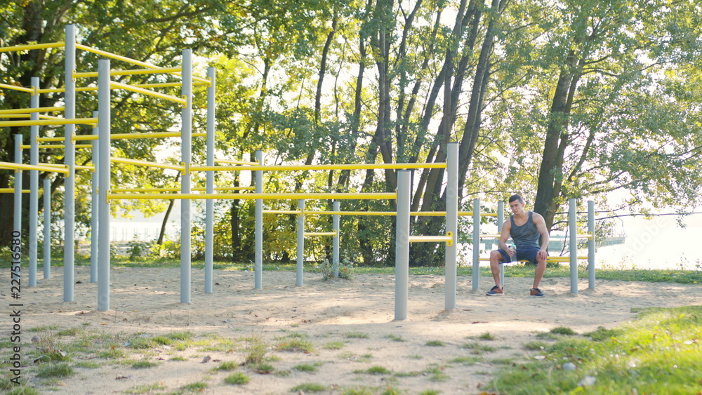 Fototapeta premium Caucasian Man Drinking Water with His Eyes Closed After Exercises