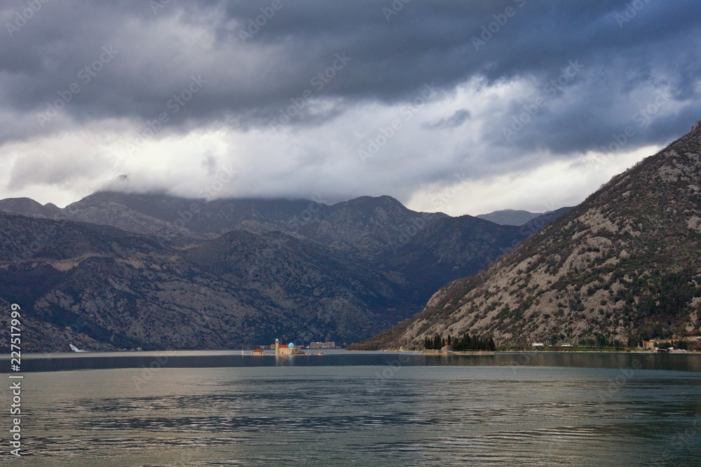 Overcast day. Mediterranean winter. Montenegro, Adriatic Sea,  Bay of Kotor. View of two small islands - Our Lady of the Rocks and St. George