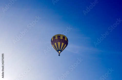 Air balloon on the blue sky background © Alisa