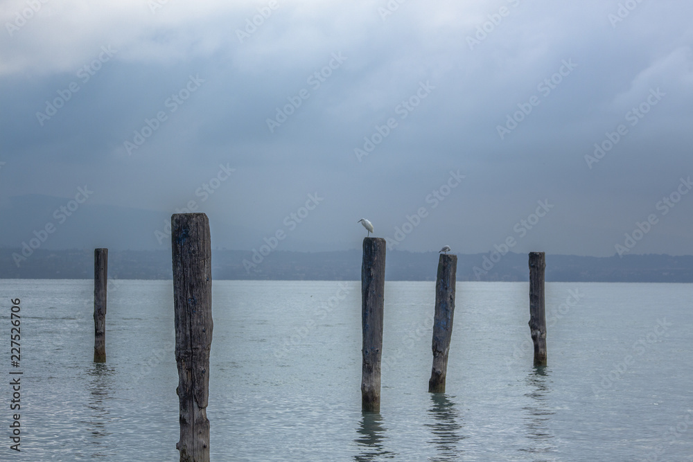 Landscape of the beautiful Lake Garda, Sirmione, northern Italy.A view from the lake to a resort town.