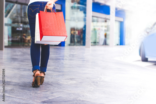 Women are walking shopping in the mall.