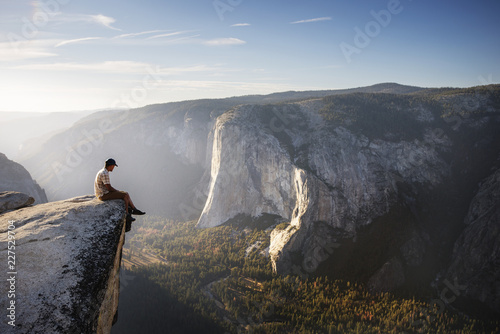Obraz na płótnie Hiker sitting on rock at Yosemite National Park, California, USA