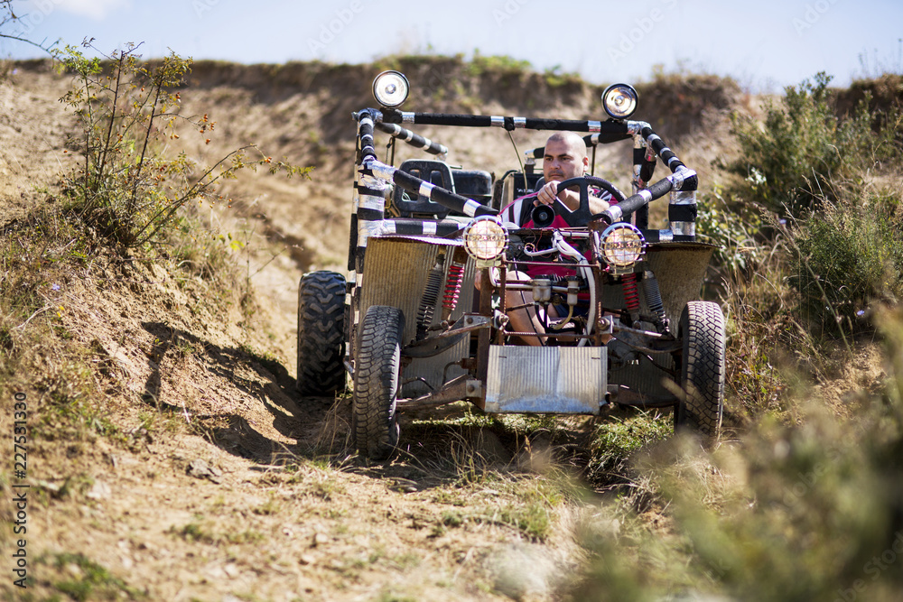 Fototapeta premium Man riding off road vehicle