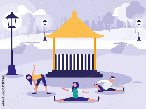 people performing stretching in park with kiosk