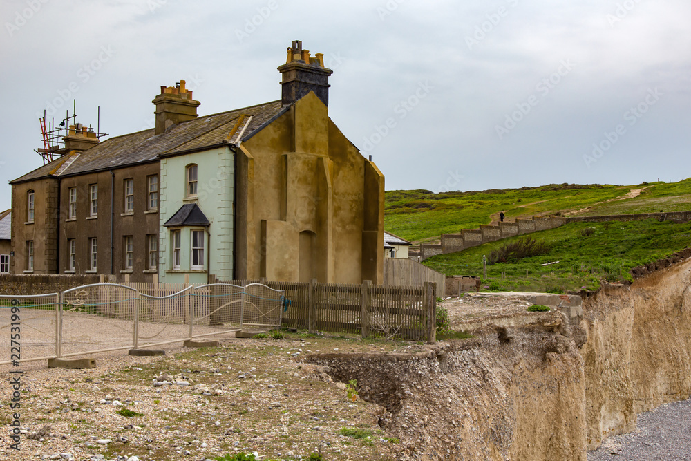 Fototapeta premium Cottages in danger at Beachy Head,