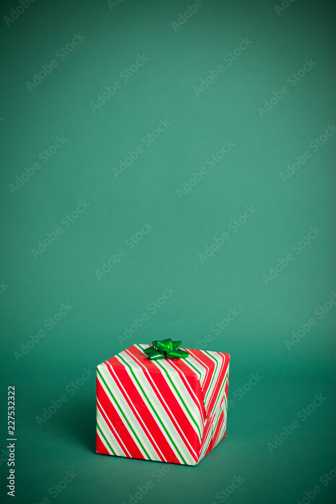 Obraz premium Simple Christmas Gift, Isolated on Green, Room for Text