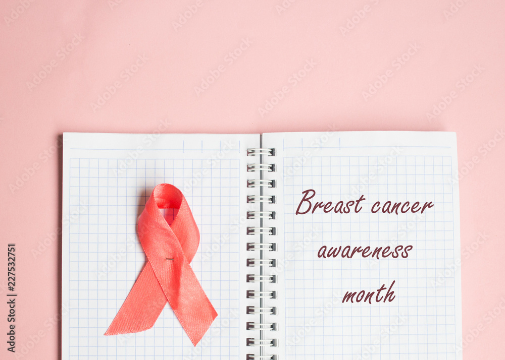 Pink ribbon symbolic bow color for Breast cancer awareness in October  month, the inscription on the notebook Stock Photo | Adobe Stock