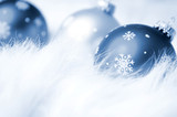 Snowflake Christmas Ornaments on Cold Snowy Background