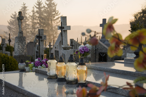 Fototapeta Gravelights on the grave on All Saints' Day