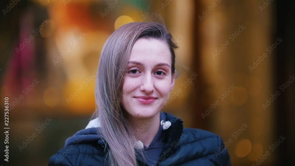 Beautiful girl looking in the camera and smiling. Autumn Beautiful girl looking in the camera and smiling. Autumn