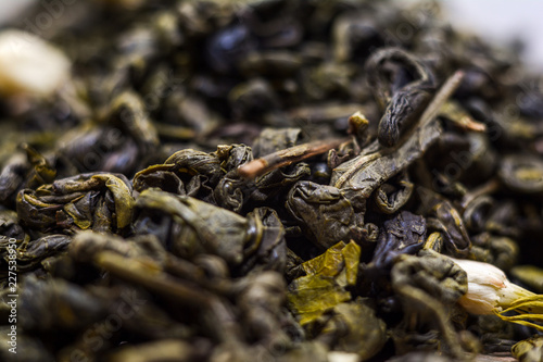 Dried green tea leaves - macro shot.