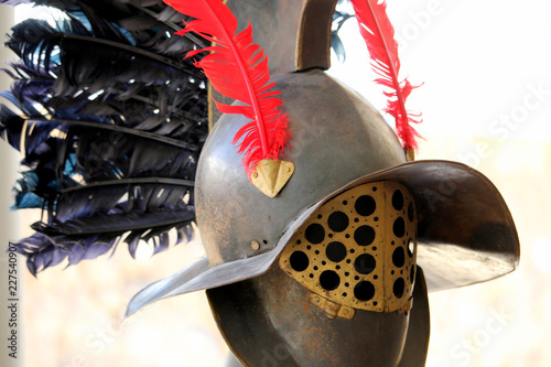 Roman gladiator helmet, with red and black feathers, as worn by Gallus or Murmillo gladiators