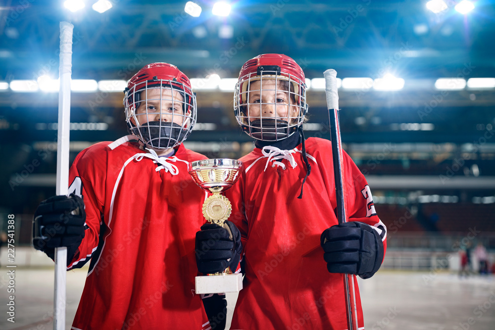 Fototapeta premium boys players ice hockey winner trophy.