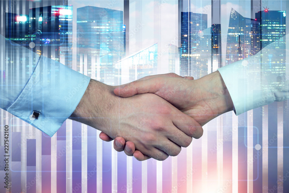 Handshake of businessman in night city Handshake of businessman in night city