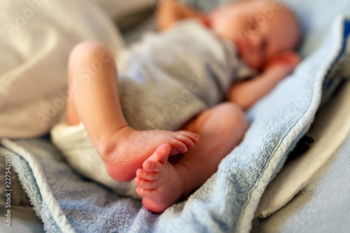 Adorable feet and toes of newborn baby photo