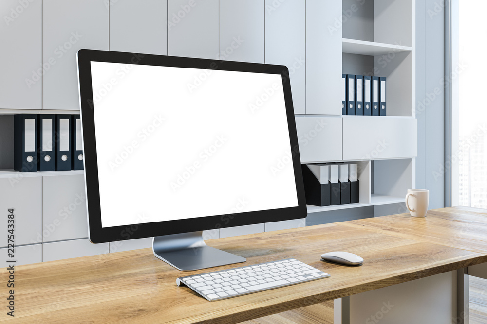 Mock up computer screen in white office interior Mock up computer screen in white office interior