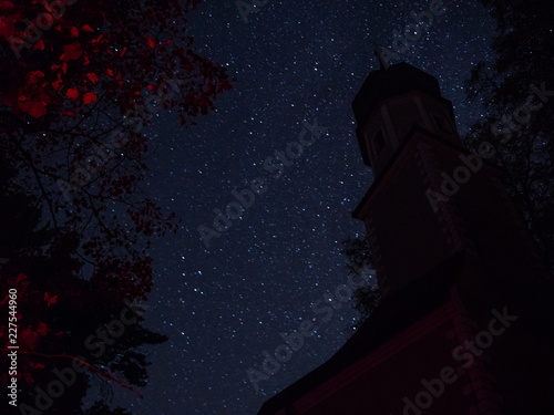 Bavarian Church at night with a clear sky and a lot of stars