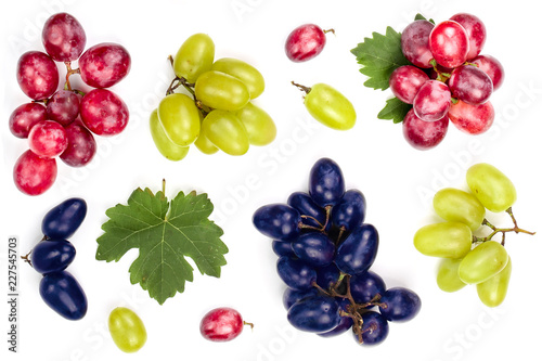 Fototapeta Naklejka Na Ścianę i Meble -  green pink and blue grapes with leaves isolated on the white background. Top view. Flat lay pattern