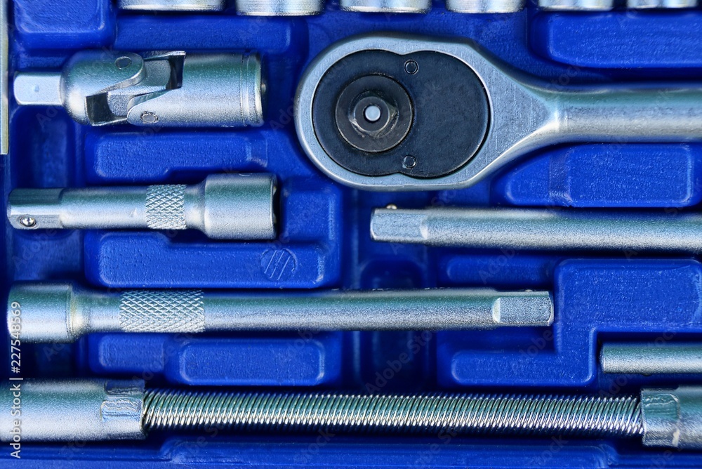set of gray iron keys in a blue plastic box set of gray iron keys in a blue plastic box