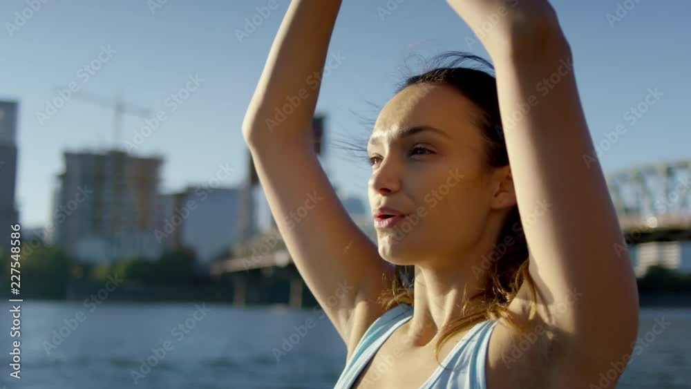 Closeup Of Healthy Young Woman, Practices Yoga On Water, She Concentrates On Breathing, Brings Her Hands To Heart Center, Slow Motion Closeup Of Healthy Young Woman, Practices Yoga On Water, She Concentrates On Breathing, Brings Her Hands To Heart Center, Slow Motion