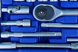 set of gray iron keys in a blue plastic box