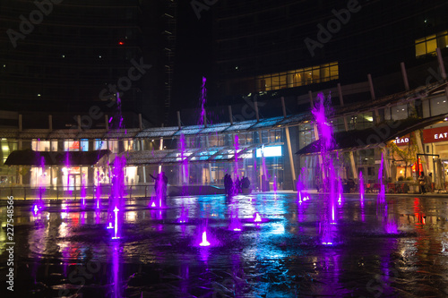 Milan  Italy  Financial district night view. Illuminated water fountains