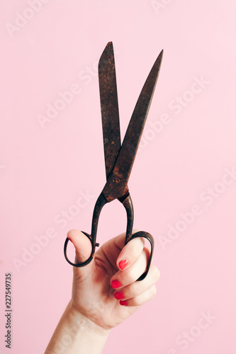 Hand holding a old scissors