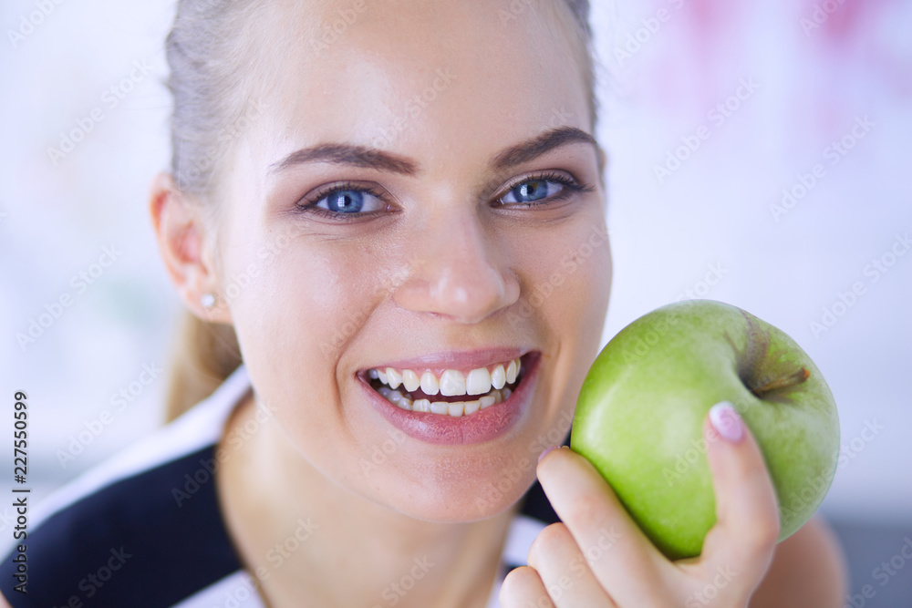 Close up portrait of healthy smiling woman with green apple. Close up portrait of healthy smiling woman with green apple.