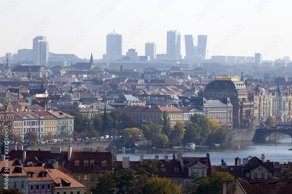 Naklejka premium Autumn Prague City with with its Buildings, Towers, Cathedrals and Bridges in the sunny Day, Czech Republic
