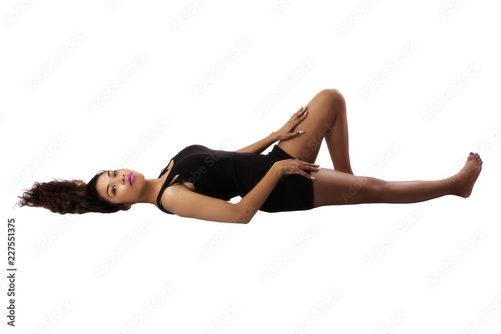 Attractive Hispanic Woman Reclining On White Background