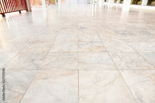 Real marble floor tile in perspective with beige abstract texture pattern of natural material i.e. stone, rock. Smooth surface for decorative wall, floor of interior building i.e. bathroom, kitchen.