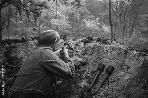 German Wehrmacht Infantry Soldier In World War II Hidden Sitting photo