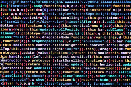 Writing programming code on laptop. Digital binary data on computer screen