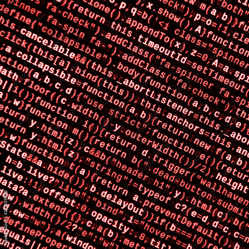 Writing programming code on laptop digital binary data on computer