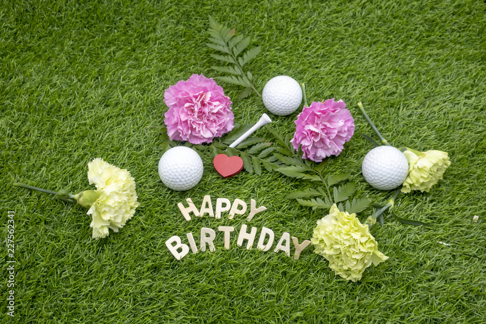 Naklejka premium Happy Birthday to golfer with golf ball and tee on green grass