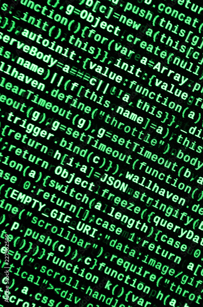 Writing programming code on laptop. Digital binary data on computer ...
