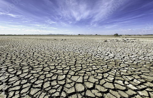 Dry, cracking soils under midday sun in Australia