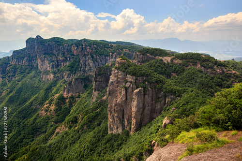 Shenxianju Scenic Area - Xianju County, Taizhou, Zhejiang Province China. Known as the "Place Where Spirits Reside", Chinese Canyon Scenery with steep cliffs, aerial view above green forests below