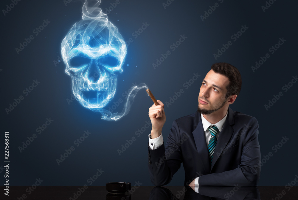 Businessman smoking with skull simbol above his head. Businessman smoking with skull simbol above his head.