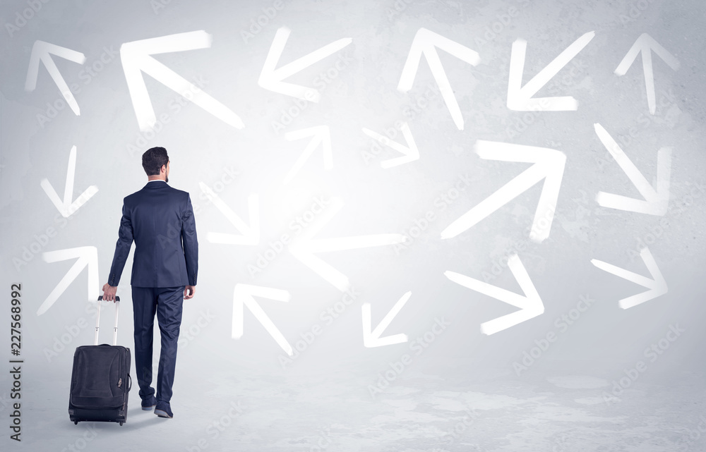 © ra2 studio - Businessman with back walking away with higgledy-piggledy arrows around