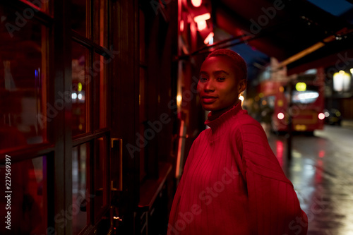 Portrait of a stylish woman during nightlife in the city