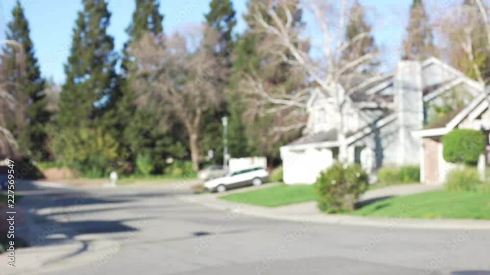 An empty street corner in a beautiful suburb with trees An empty street corner in a beautiful suburb with trees