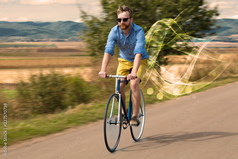 Naklejka premium Gorgeous biker in the nature going somewhere with ethereal concept