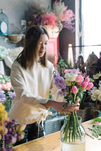 Floral shop owner working in the flower shop photo